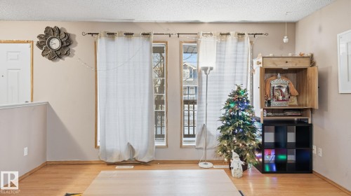 Foyer entrance featuring a textured ceiling and light wood-style flooring - 1509 Jarvis Cr, Edmonton, AB - Indoor Photo Showing Other Room