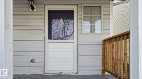 Property entrance with a wooden deck - 1509 Jarvis Cr, Edmonton, AB - Outdoor With Exterior