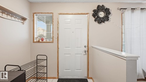 Foyer featuring a textured ceiling - 1509 Jarvis Cr, Edmonton, AB - Indoor Photo Showing Other Room