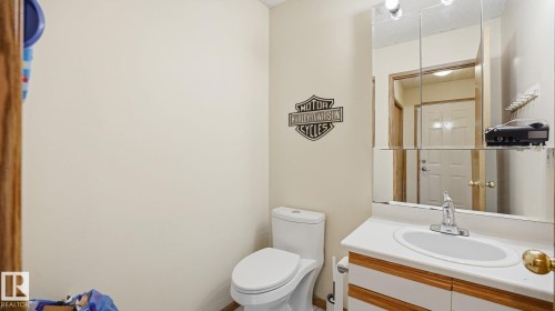 Half bath with vanity and a textured ceiling - 1509 Jarvis Cr, Edmonton, AB - Indoor Photo Showing Bathroom