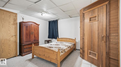 Carpeted bedroom featuring a paneled ceiling and a relaxing sauna - 1509 Jarvis Cr, Edmonton, AB - Indoor Photo Showing Bedroom