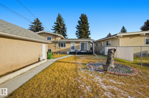 Rear view of property with stucco siding - 12916 95A Street, Edmonton, AB - Outdoor