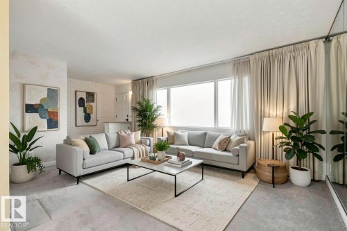 The living area features light-colored carpeting, large windows with privacy coverings, and two light-colored sofas - 12916 95A Street, Edmonton, AB - Indoor Photo Showing Living Room