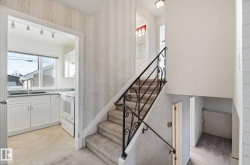 Stairs with wallpapered walls - 12916 95A Street, Edmonton, AB - Indoor