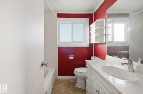 Full bath featuring vanity, plenty of natural light, and bathing tub / shower combination - 12916 95A Street, Edmonton, AB - Indoor Photo Showing Bathroom