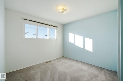 View of carpeted spare room - 12916 95A Street, Edmonton, AB - Indoor Photo Showing Other Room