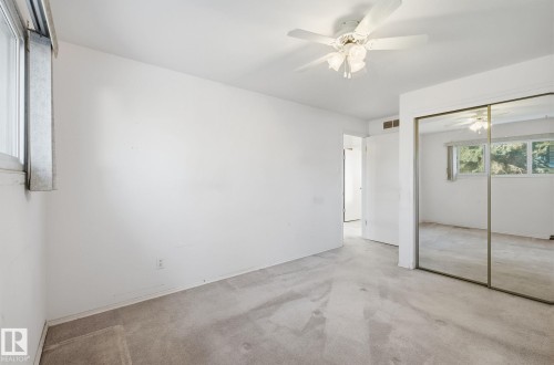 Unfurnished bedroom featuring ceiling fan, carpet flooring, and a closet - 12916 95A Street, Edmonton, AB - Indoor Photo Showing Other Room