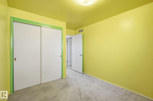 Unfurnished bedroom featuring carpet flooring and a closet - 12916 95A Street, Edmonton, AB - Indoor Photo Showing Other Room