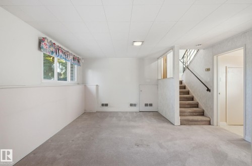 Basement featuring stairs and carpet floors - 12916 95A Street, Edmonton, AB - Indoor Photo Showing Other Room