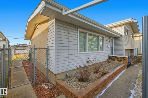 View of side of property featuring a gate - 12916 95A Street, Edmonton, AB - Outdoor With Exterior