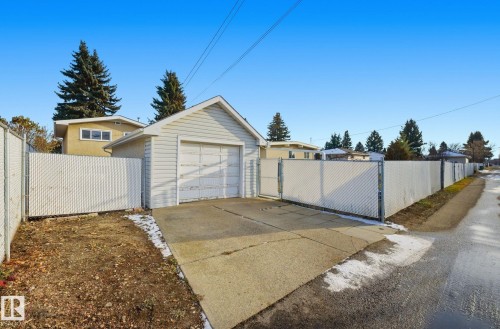 Detached garage with driveway and a gate - 12916 95A Street, Edmonton, AB - Outdoor