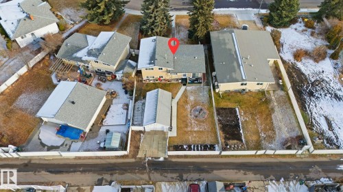 Snowy aerial view with a residential view - 12916 95A Street, Edmonton, AB - Outdoor With View