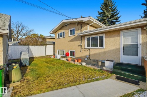 Back of property featuring stucco siding and entry steps - 12916 95A Street, Edmonton, AB - Outdoor