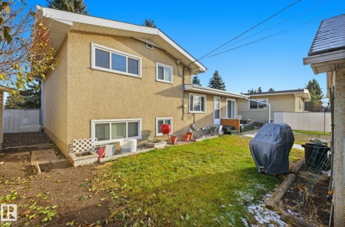 Back of house featuring a fenced backyard, a patio, and stucco siding - 12916 95A Street, Edmonton, AB - Outdoor With Exterior