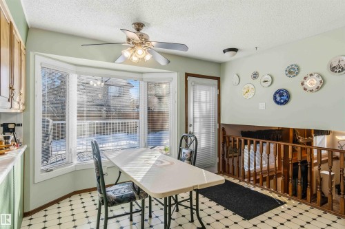 Dining space featuring light floors, a textured ceiling, and a ceiling fan - 17619 94 Ave, Edmonton, AB - Indoor Photo Showing Dining Room
