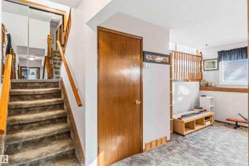 Stairway featuring carpet and a textured ceiling - 17619 94 Ave, Edmonton, AB - Indoor Photo Showing Other Room