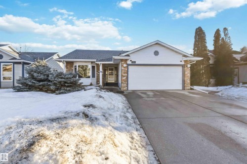 Ranch-style home featuring brick siding, a garage, driveway, and roof with shingles - 17619 94 Ave, Edmonton, AB - Outdoor With Facade