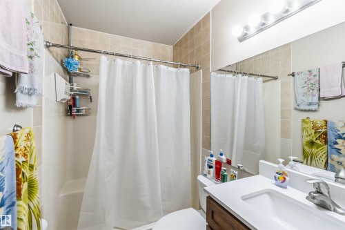 Bathroom featuring vanity and curtained shower - 17619 94 Ave, Edmonton, AB - Indoor Photo Showing Bathroom