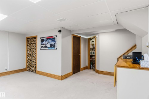 Finished basement featuring carpet flooring and a paneled ceiling - 17619 94 Ave, Edmonton, AB - Indoor