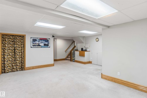 Finished below grade area featuring a paneled ceiling and light colored carpet - 17619 94 Ave, Edmonton, AB - Indoor Photo Showing Other Room