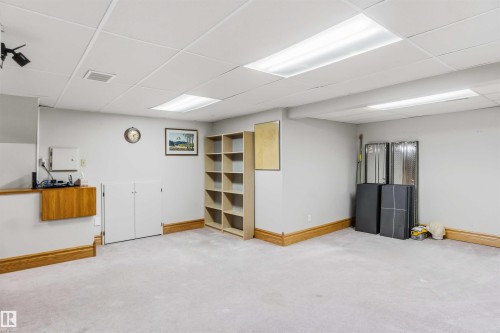 Finished below grade area with a drop ceiling and light carpet - 17619 94 Ave, Edmonton, AB - Indoor Photo Showing Basement