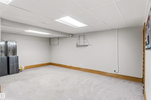 Finished basement featuring a drop ceiling and light carpet - 17619 94 Ave, Edmonton, AB - Indoor Photo Showing Basement