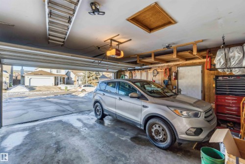 Garage featuring a garage door opener - 17619 94 Ave, Edmonton, AB - Indoor Photo Showing Garage
