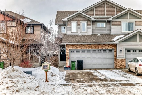 Craftsman house with a shingled roof, an attached garage, and driveway - 9645 Simpson Place, Edmonton, AB 