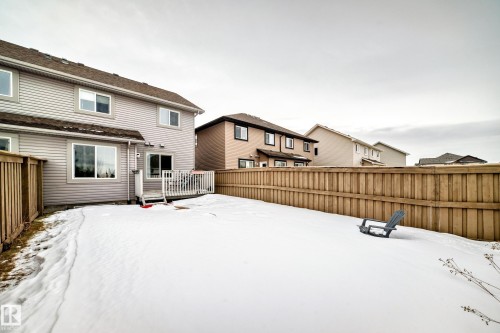 Snowy yard featuring a deck - 9645 Simpson Place, Edmonton, AB 