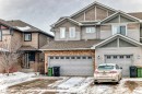 View of front of property with a shingled roof, an attached garage, and driveway - 9645 Simpson Place, Edmonton, AB 