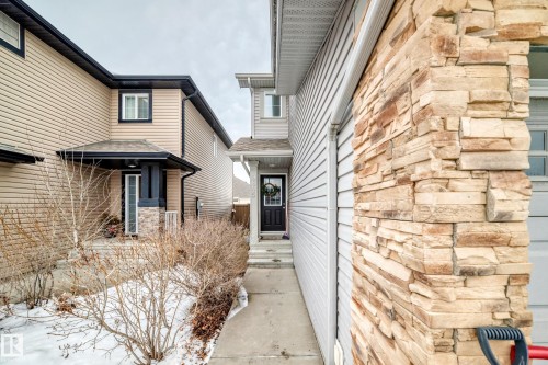 Doorway to property with stone siding - 9645 Simpson Place, Edmonton, AB 