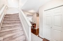 Staircase with a textured ceiling and wood finished floors - 9645 Simpson Place, Edmonton, AB  - Indoor Photo Showing Other Room 