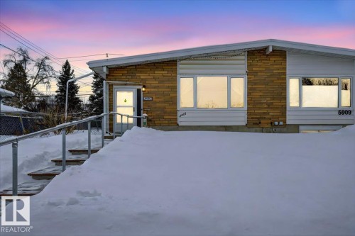 View of front of house with stone siding - Edmonton, AB - Outdoor With Exterior