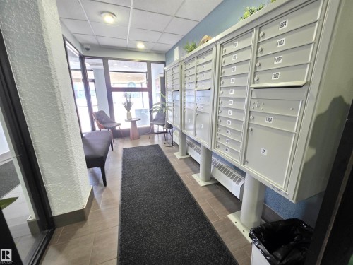 Common area with a paneled ceiling and a textured wall - 701 10155 114 Street, Edmonton, AB - Indoor Photo Showing Other Room