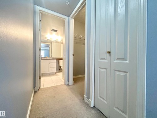 Hallway featuring light carpet and baseboards - 1402 10909 103 Avenue, Edmonton, AB - Indoor Photo Showing Other Room