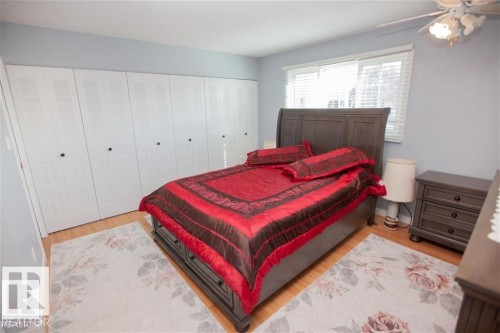 Bedroom featuring light wood-style flooring and a closet - 17208 106 Street, Edmonton, AB - Indoor Photo Showing Bedroom