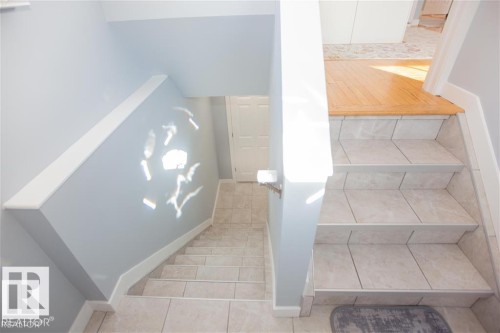 Stairs with tile patterned flooring - 17208 106 Street, Edmonton, AB - Indoor Photo Showing Other Room