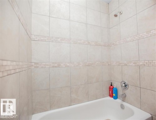 Bathroom featuring shower / bathtub combination - 17208 106 Street, Edmonton, AB - Indoor Photo Showing Bathroom