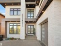 View of exterior entry with french doors and a garage - 4809 Woolsey Lane, Edmonton, AB  - Outdoor With Exterior 