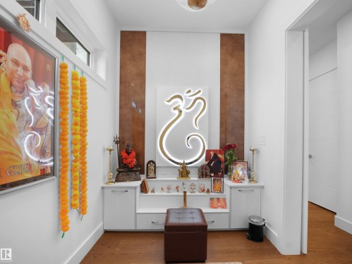 Bathroom featuring wood finished floors and vanity - 4809 Woolsey Lane, Edmonton, AB - Indoor Photo Showing Other Room