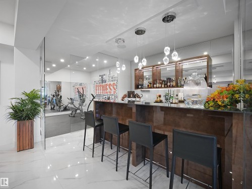 Indoor dry bar with hanging light fixtures - 4809 Woolsey Lane, Edmonton, AB - Indoor