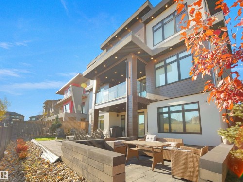 Rear view of property featuring outdoor lounge area, a balcony, and a patio area - 4809 Woolsey Lane, Edmonton, AB - Outdoor