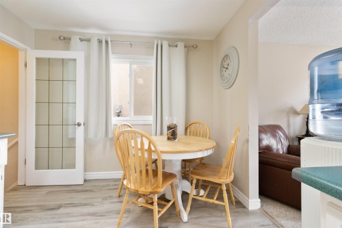 Dining room featuring light wood-type flooring - 4423 18 Avenue, Edmonton, AB - Indoor Photo Showing Dining Room