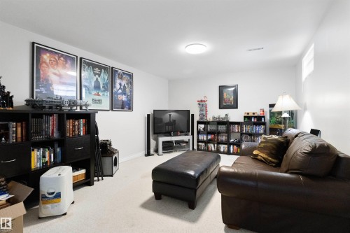 Living room with carpet and baseboards - 4423 18 Avenue, Edmonton, AB - Indoor Photo Showing Living Room