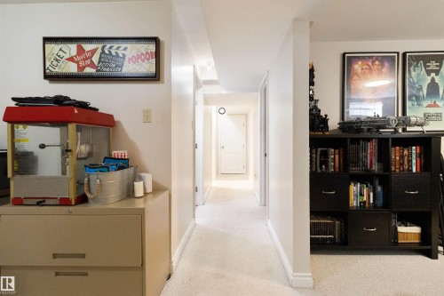 Corridor featuring light colored carpet and baseboards - 4423 18 Avenue, Edmonton, AB - Indoor Photo Showing Other Room