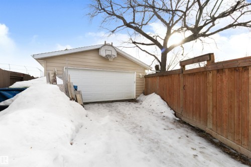 Snow covered garage featuring a garage - 4423 18 Avenue, Edmonton, AB - Outdoor