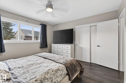 Bedroom featuring dark wood-style flooring, a closet, and ceiling fan - 5 Langley Drive, Fort Saskatchewan, AB - Indoor Photo Showing Bedroom