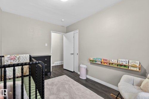 Bedroom with dark wood-style flooring - 5 Langley Drive, Fort Saskatchewan, AB - Indoor Photo Showing Bedroom