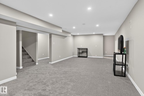 Finished below grade area with light carpet and recessed lighting - 5 Langley Drive, Fort Saskatchewan, AB - Indoor Photo Showing Other Room