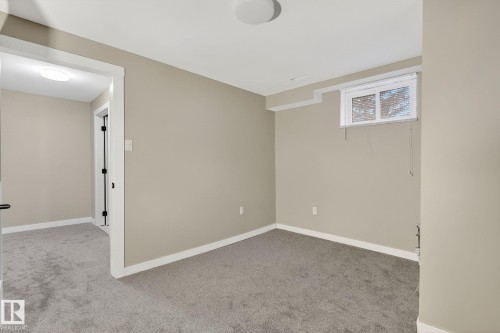 Empty room featuring light carpet - 5 Langley Drive, Fort Saskatchewan, AB - Indoor